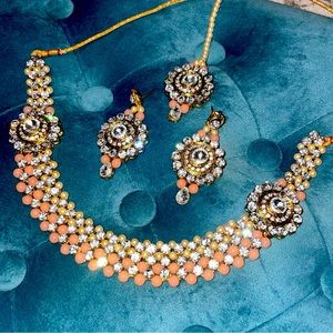 Gold and coral necklace and earrings and forehead tika set